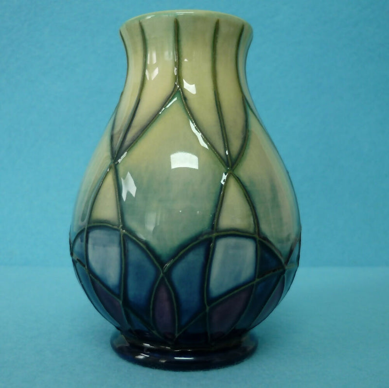 A Small Moorcroft Vase in the Indigo Pattern by Emma Bossons.
