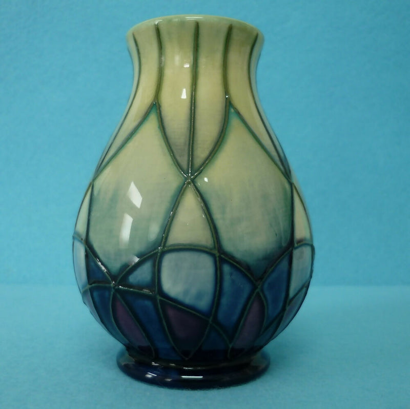 A Small Moorcroft Vase in the Indigo Pattern by Emma Bossons.