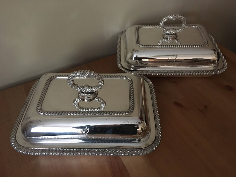 Pair of late Georgian Old Sheffield Plate crested entree dishes with covers and detachable handles.