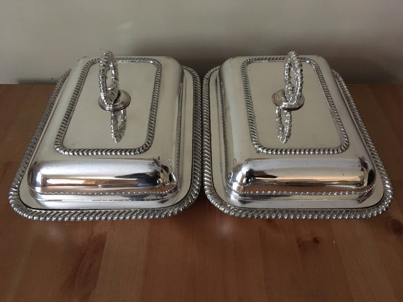 Pair of late Georgian Old Sheffield Plate crested entree dishes with covers and detachable handles.
