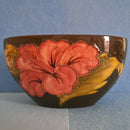 A Moorcroft Oval Bowl in Hibiscus Design by Walter Moorcroft