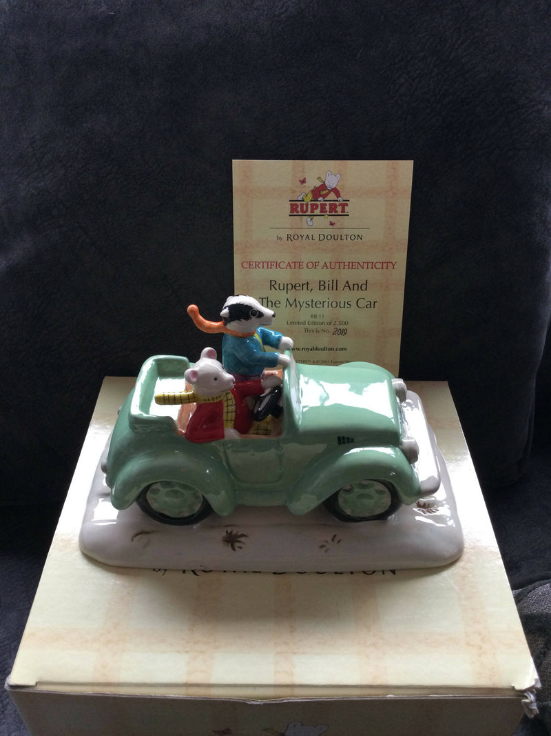 Royal Doulton - Rupert The Bear in car figurine Royal Doulton Rupert Bill And The Mysterious Car