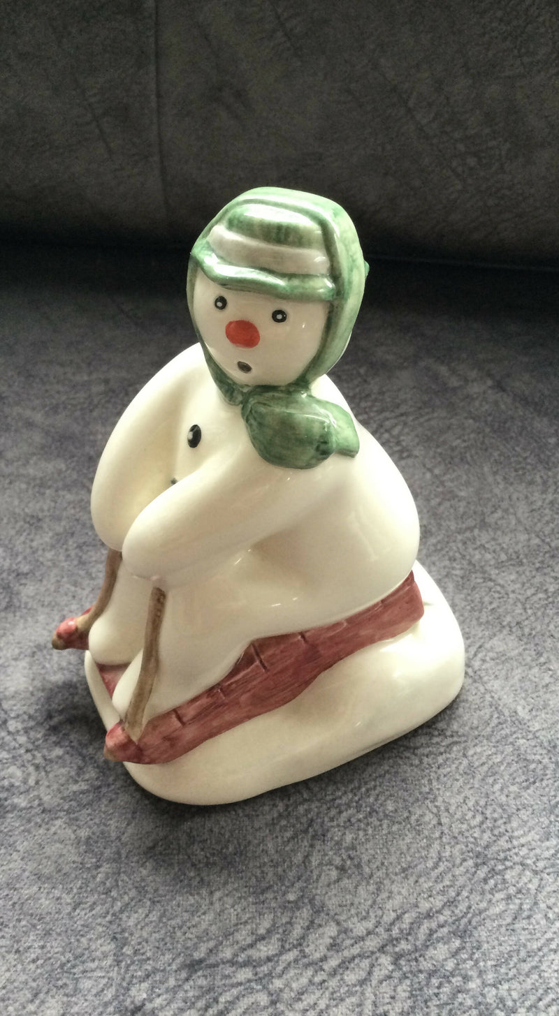 Royal Doulton - Snowman Figurine Royal Doulton - Tobogganing Snowman figurine Boxed