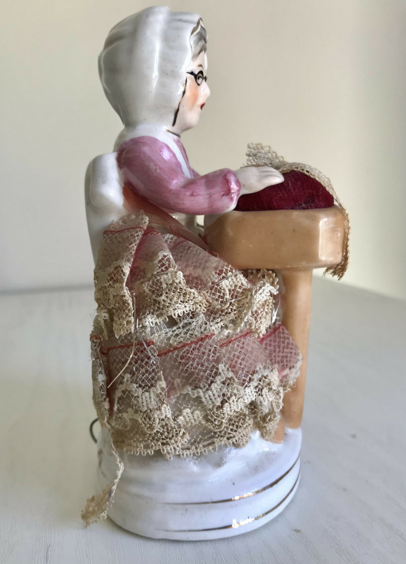 Vintage Lady Pin Cushion with built in tape measure.