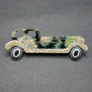 Lea Stein green-gold limousine brooch