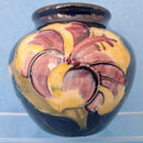 A Moorcroft Vase in the Hibiscus Design. Royal Appointment Label.