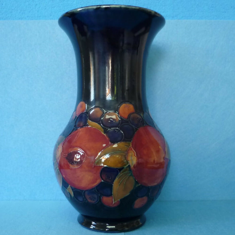 Moorcroft Vase (9.84 inch). Pomegranate Design by William Moorcroft.