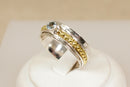 A Silver & Blue Topaz Spinner Ring