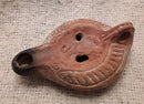 A Roman Redware Terracotta Oil Lamp With Lion Decoration.