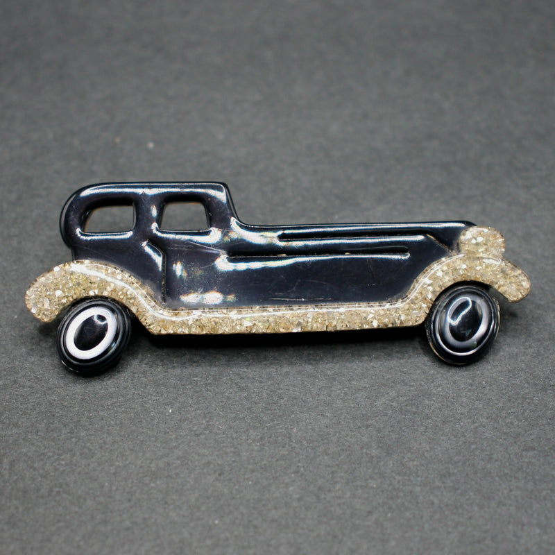 Lea Stein black-gold limousine brooch