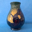 A Moorcroft Vase in the Clematis Pattern by Walter Moorcroft.