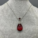 Silver and red amber pendant