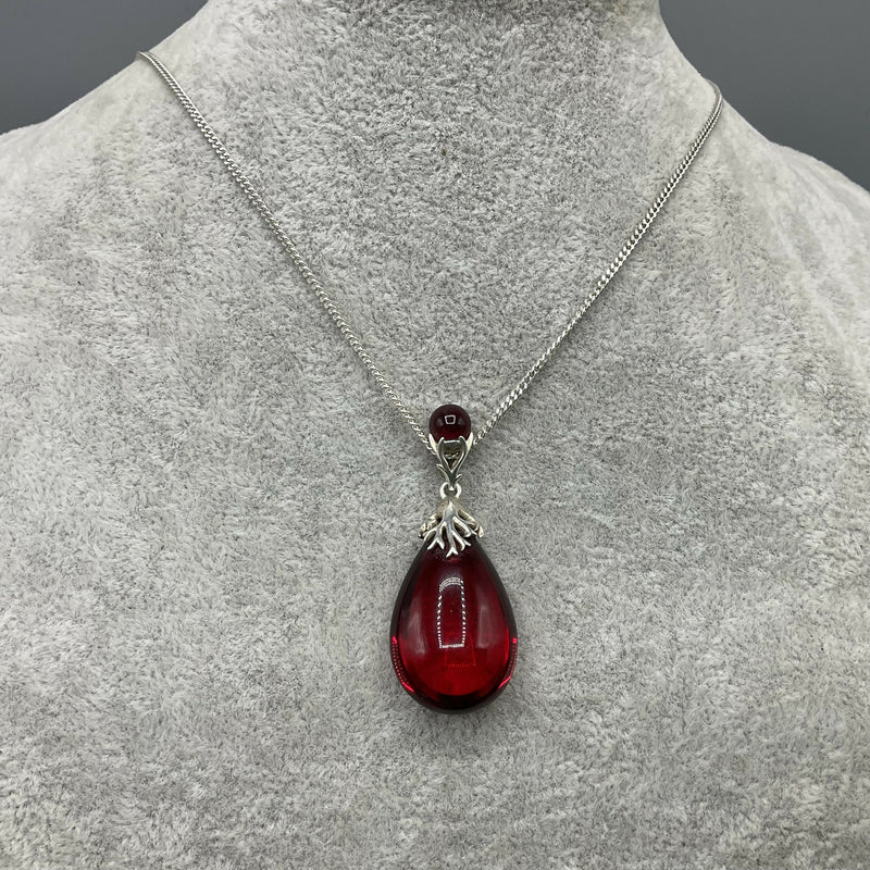 Silver and red amber pendant