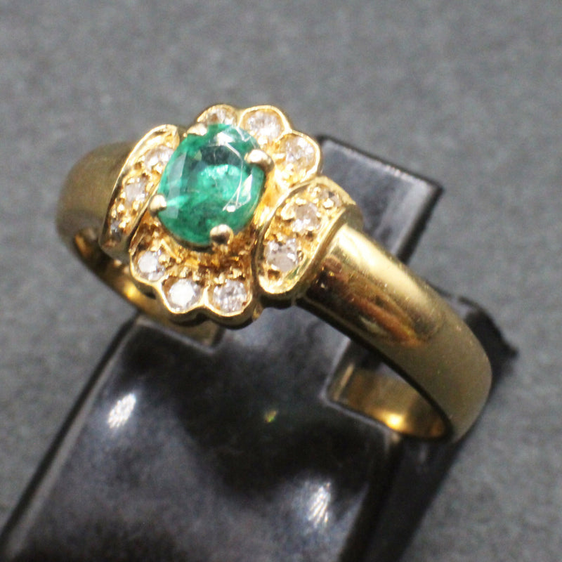 18ct emerald and diamond cluster ring