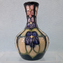 A Small Moorcroft Vase in the Violet Design by Sally Tuffin