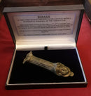 A Roman Bronze Patera Handle Showing The Head Of God Bacchus.