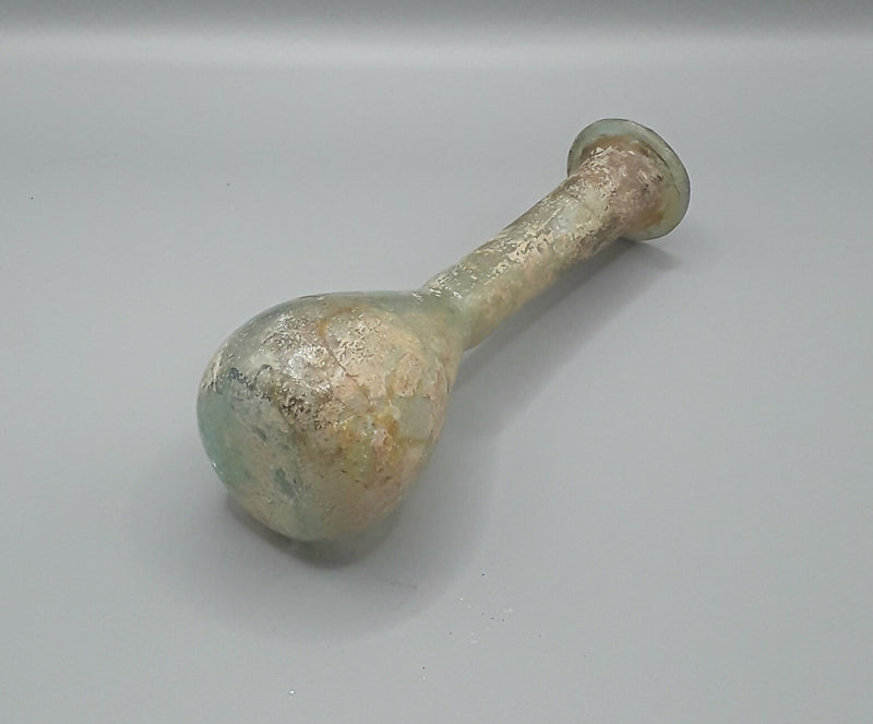 A Roman Small Hand Blown Glass Unguentarium Flask.