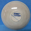 A Moorcroft Cup and Saucer in the Pansy Pattern by William Moorcroft