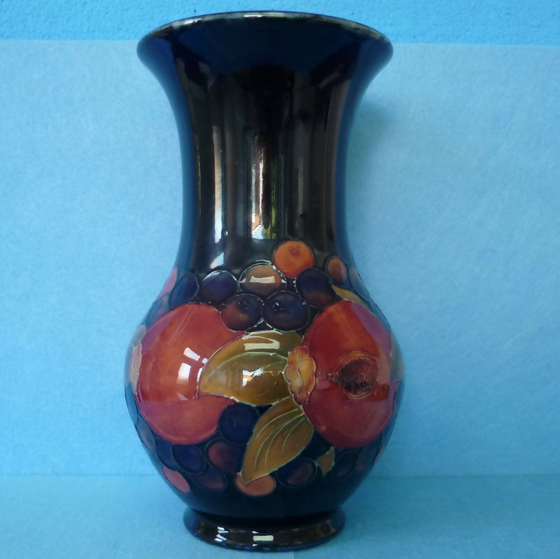 Moorcroft Vase (9.84 inch). Pomegranate Design by William Moorcroft.