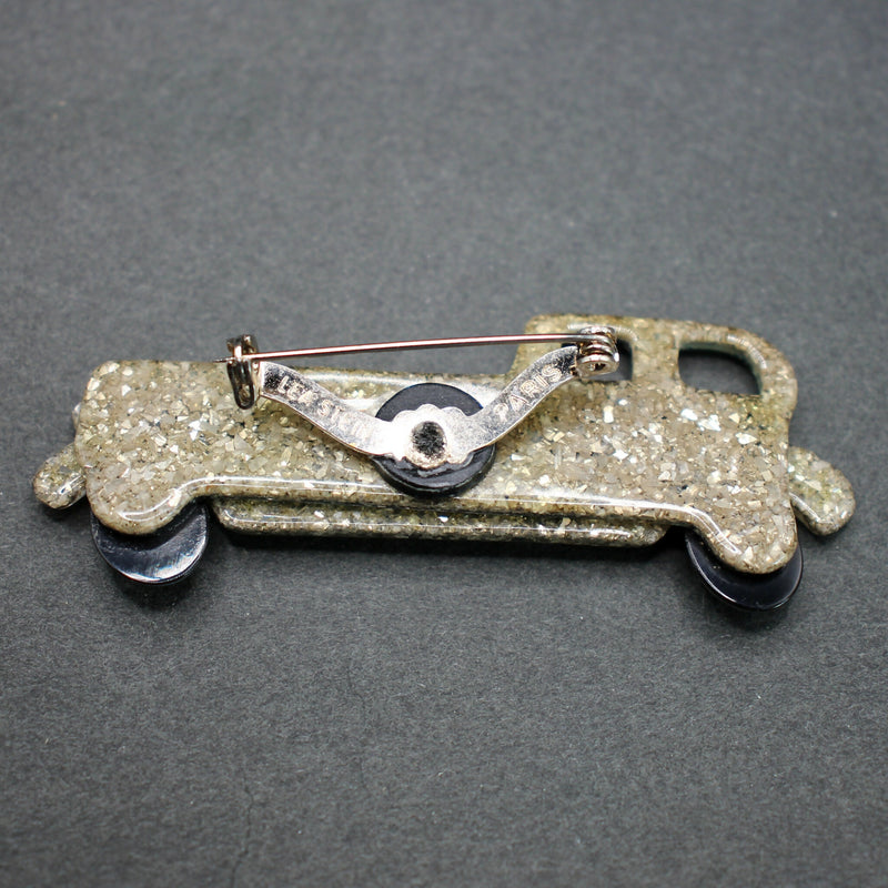 Lea Stein green-gold limousine brooch