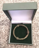 An Anglo Saxon Bronze Annular Cloak Brooch.