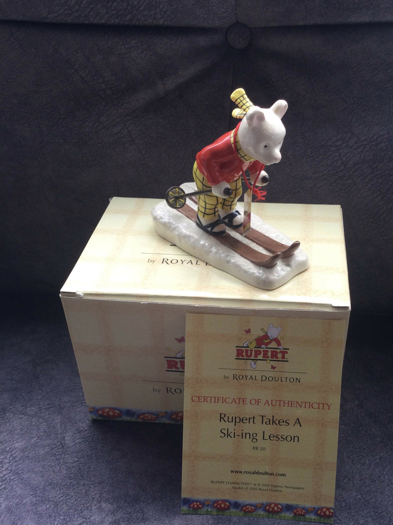 Royal Doulton Rupert The Bear figurine Royal Doulton Rupert takes skiing lesson Box cert RB20