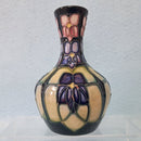 A Small Moorcroft Vase in the Violet Design by Sally Tuffin
