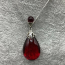 Silver and red amber pendant