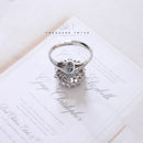 18ct White Gold Blue Topaz & Diamond Cluster Ring