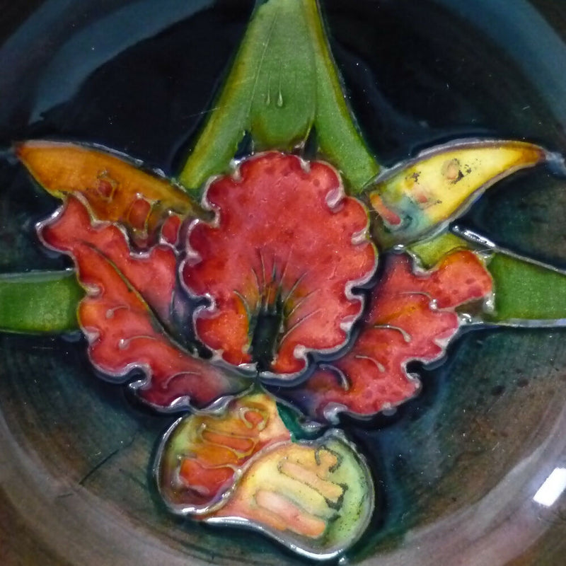 A Moorcroft Flambé Bowl in the Orchid Pattern by Walter Moorcroft