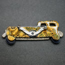 Lea Stein black-gold limousine brooch