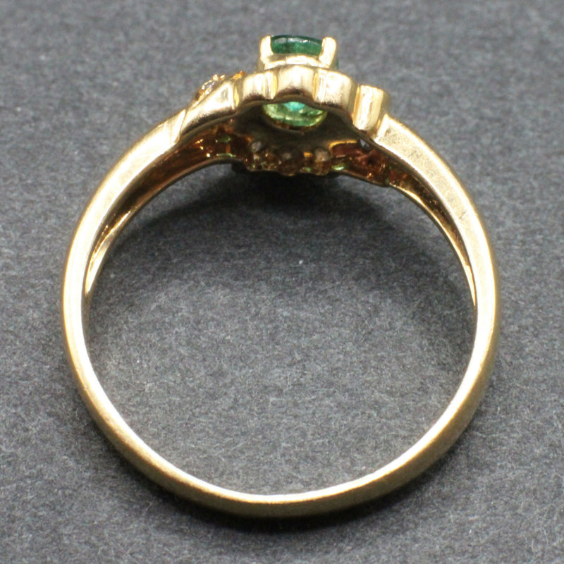 18ct emerald and diamond cluster ring