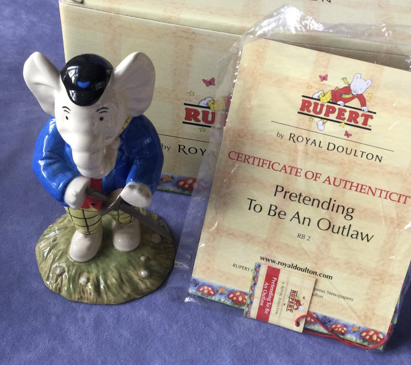 Royal Doulton - Rupert The Bear figurine Royal Doulton Pretending To Be A Outlaw figure