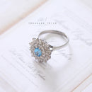 18ct White Gold Blue Topaz & Diamond Cluster Ring