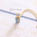 18ct Blue Topaz Pendant on 9ct Chain