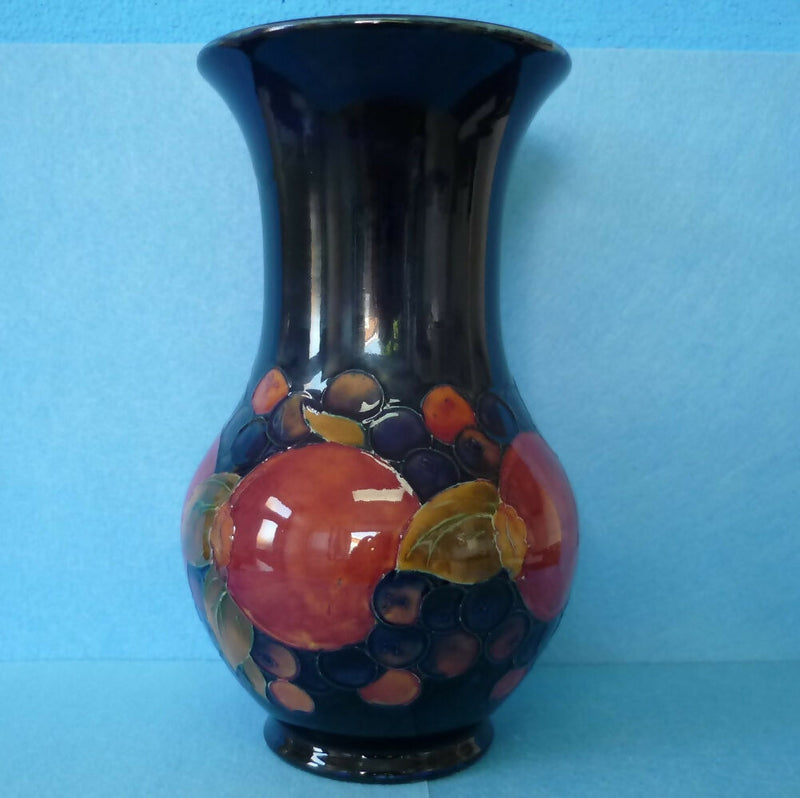 Moorcroft Vase (9.84 inch). Pomegranate Design by William Moorcroft.