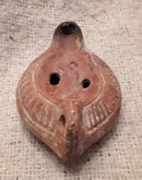 A Roman Redware Terracotta Oil Lamp With Lion Decoration.
