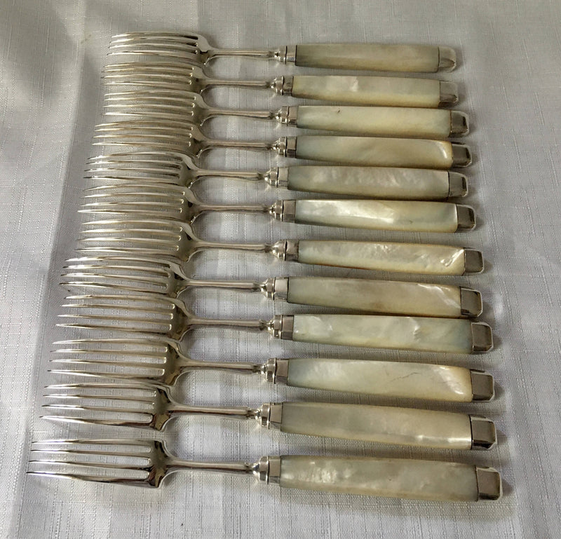 Georgian, George III, silver and mother of pearl dessert knives and forks for twelve, circa 1810.