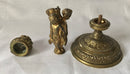 Victorian gilt brass neo classical candlestick adorned with putti harvesting grapes.