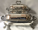 Late Georgian pair of Old Sheffield Plated, crested, entree dishes and covers on warming stands. Circa 1820.