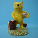 A Boxed Royal Doulton Winnie The Pooh Figurine - Pooh Counting The Honeypots