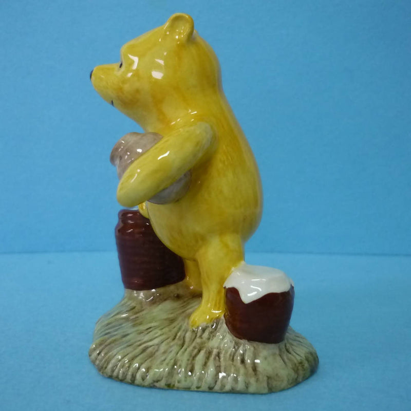 A Boxed Royal Doulton Winnie The Pooh Figurine - Pooh Counting The Honeypots