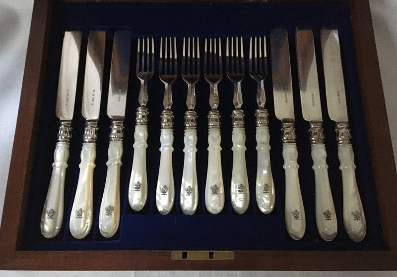 Victorian cased set of crested silver plate and mother of pearl dessert cutlery for twelve. Elkington 1880 and 1881.