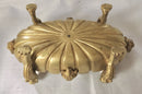 Regency period gilt bronze inkstand raised on lioness paw feet and adorned with ram masks.