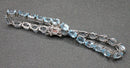Silver blue topaz set line bracelet