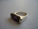 A Silver Ring With an Amethyst Colour Stone
