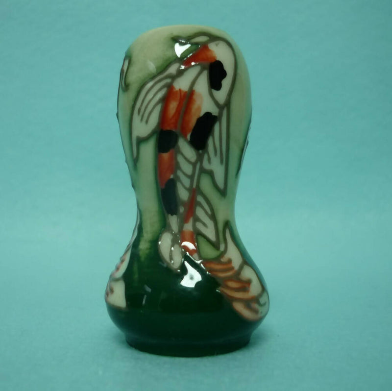 A Miniature Moorcroft Vase with Box and Sleeve.