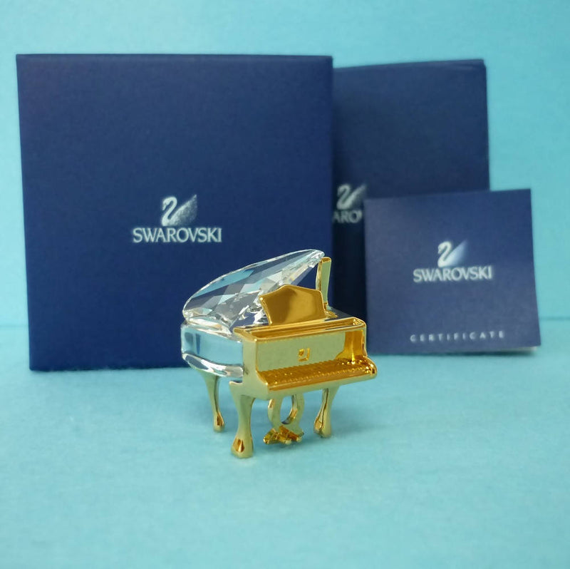 A Boxed Swarovski Crystal and Gold Tone Piano Ornament
