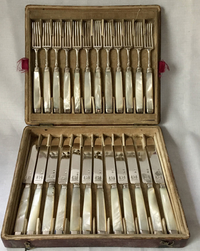 Georgian, George III, silver and mother of pearl dessert knives and forks for twelve, circa 1810.