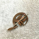 Sickle and wheat brooch